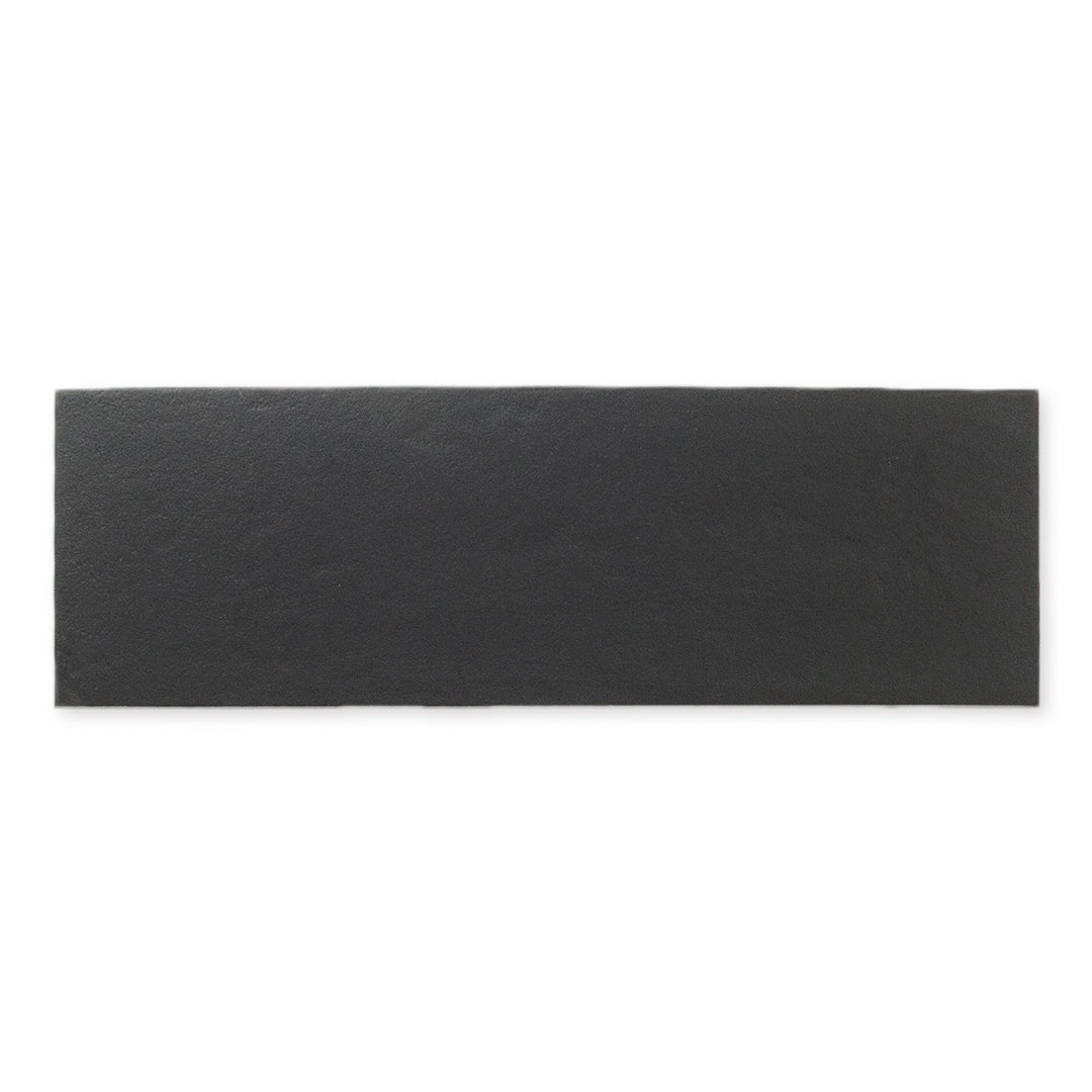 Single tile photo featuring black 4x12  with a soft stone appearance and texture.  Single tile photo featuring black 4x12  with a soft stone appearance and texture.