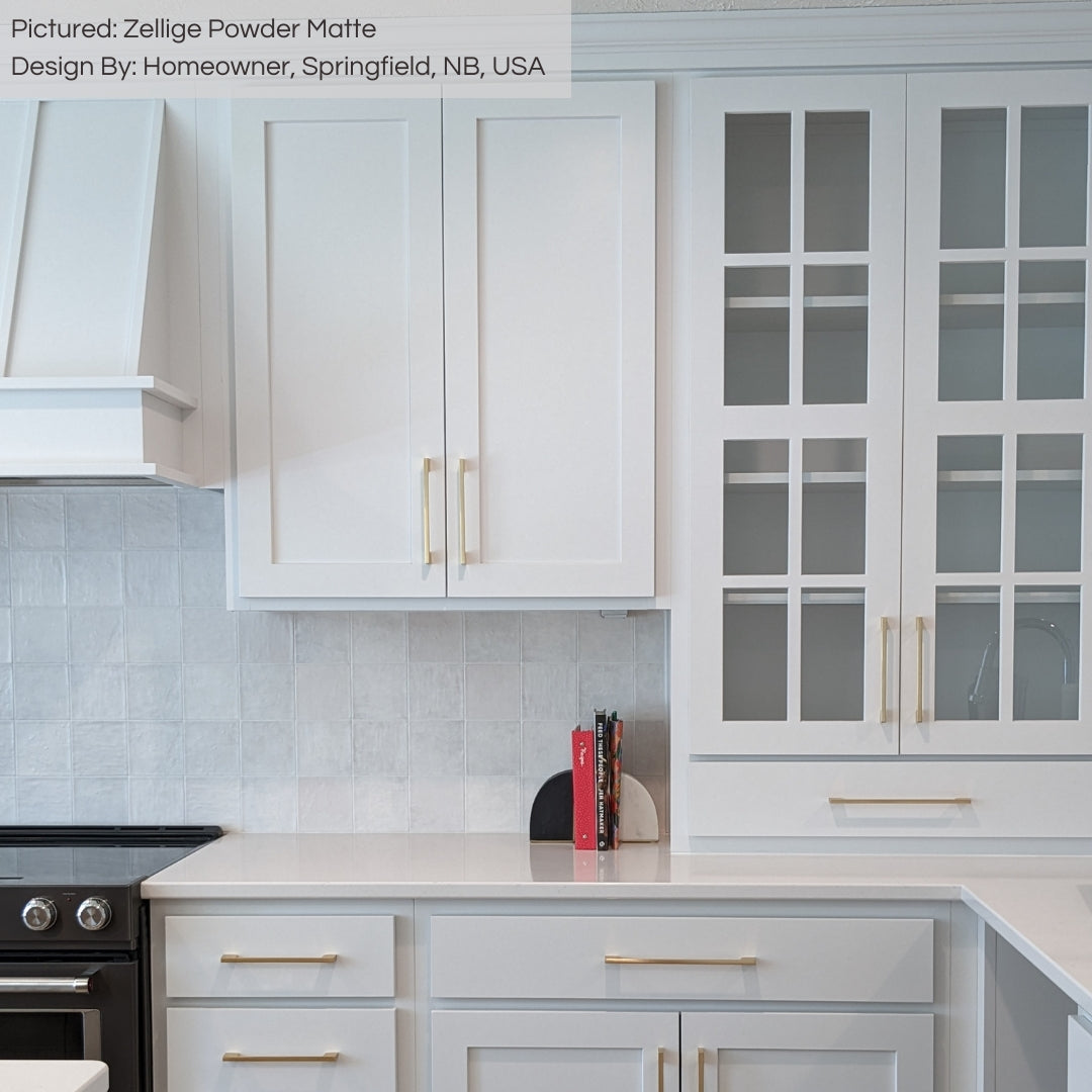 A classic and timeless white kitchen with zellige powder matte textured handmade look tiles installed on the backsplash.  A classic and timeless white kitchen with zellige powder matte textured handmade look tiles installed on the backsplash.