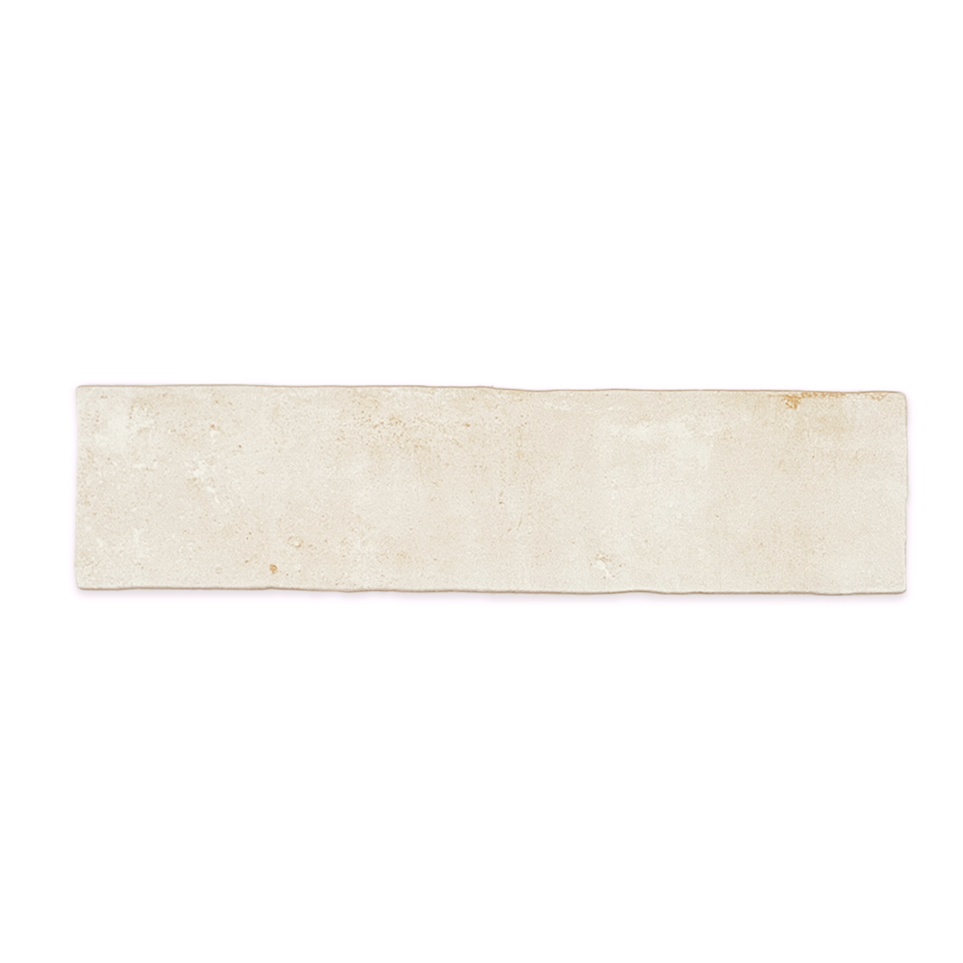 A single 11x2.75 brick clay chalk white stone look tile with a natural looking edge A single 11x2.75 brick clay chalk white stone look tile with a natural looking edge