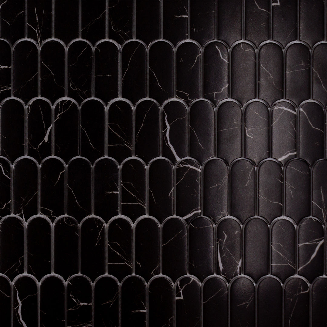 Close up of black marquina marble look feather scallop mosaic sheet tiles to show the deep colour, marble veining and finish. 