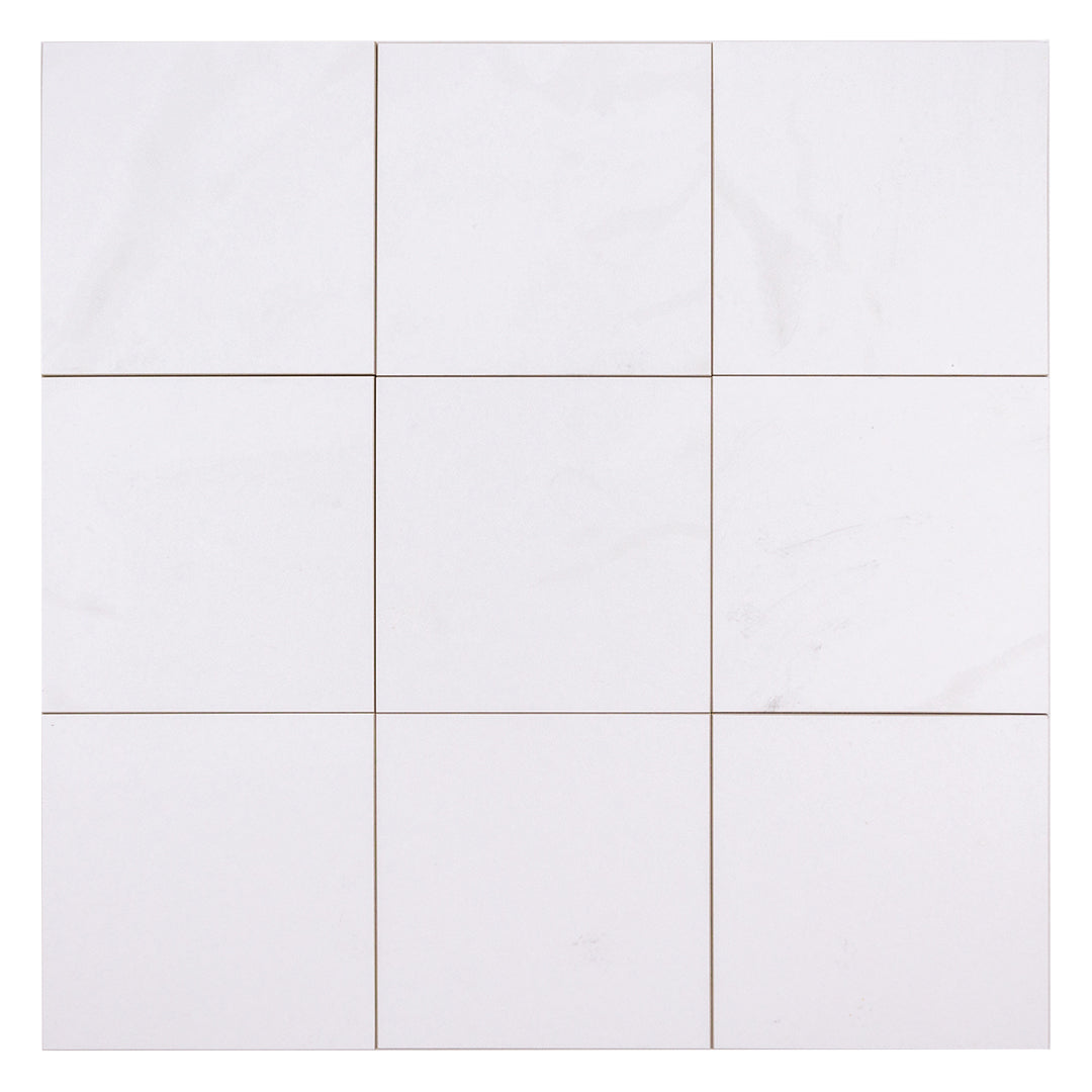 Ariel view of nine 5x5 white stone look tiles that have a matte finish and a subtle marble pattern.