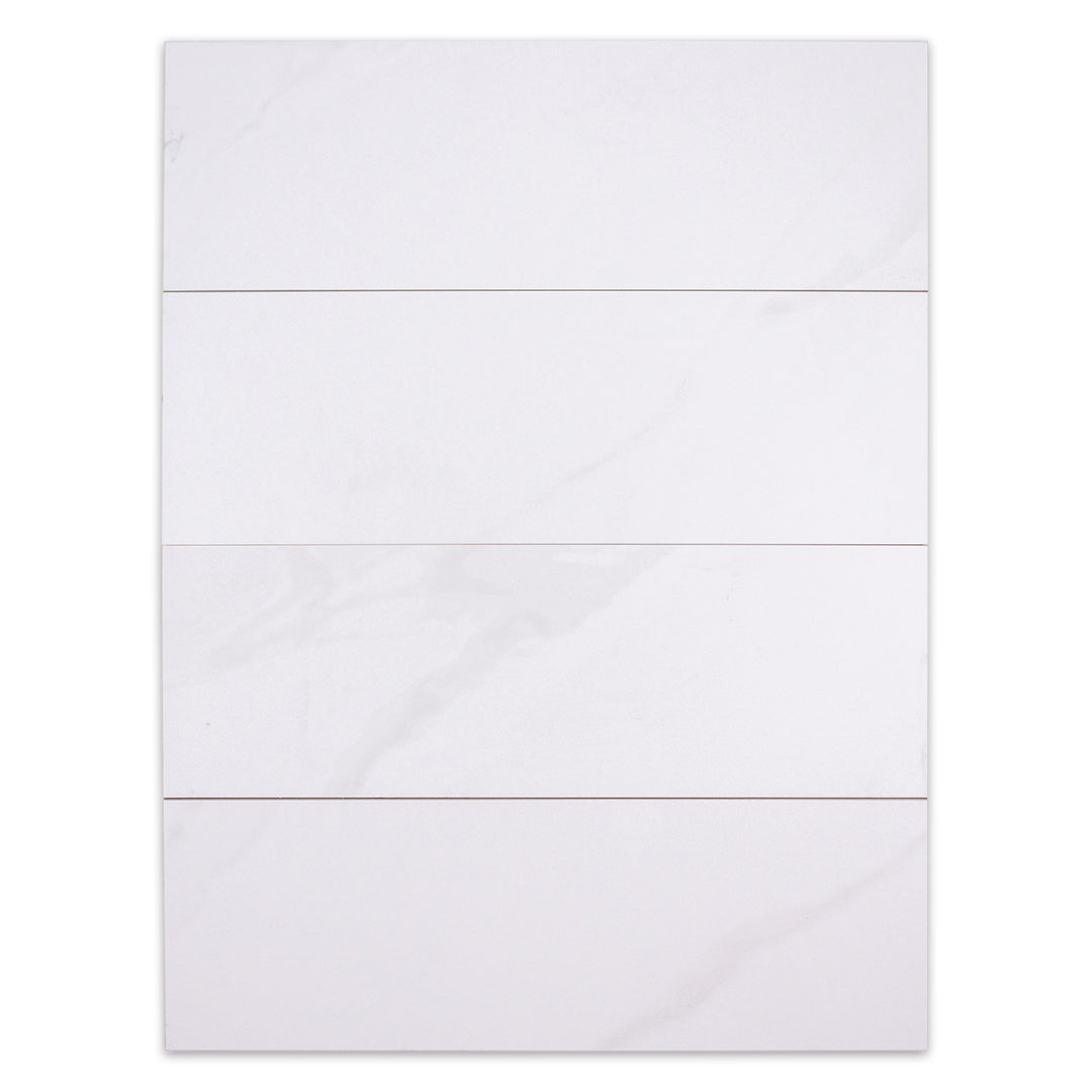 Ariel view of four 5x16 white stone look tiles to highlight the very soft marble pattern. 