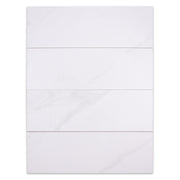 Ariel view of four 5x16 white stone look tiles to highlight the very soft marble pattern. 