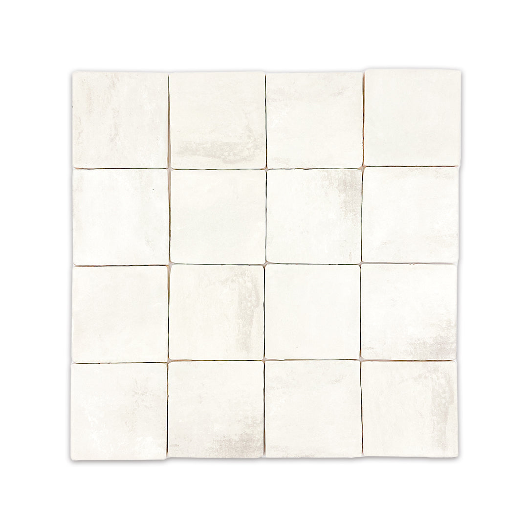 Ariel view of a group of 4x4 satin zellige tiles named plaster off white. they have a handmade look a subtle colour variation
