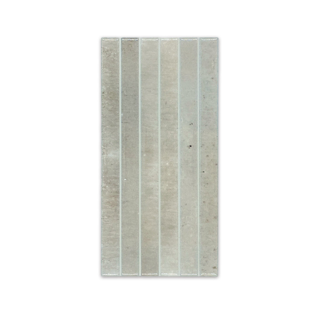 Ariel view of a single 5x10 panel tile in glossy grey, the tile has a 3D linear faux grout line kitkat look and colour variation. 