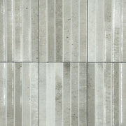 Ariel view of a group of 5x10 panel tiles in glossy grey, the tile has a 3D linear faux grout line fluted kitkat look and colour variation. 