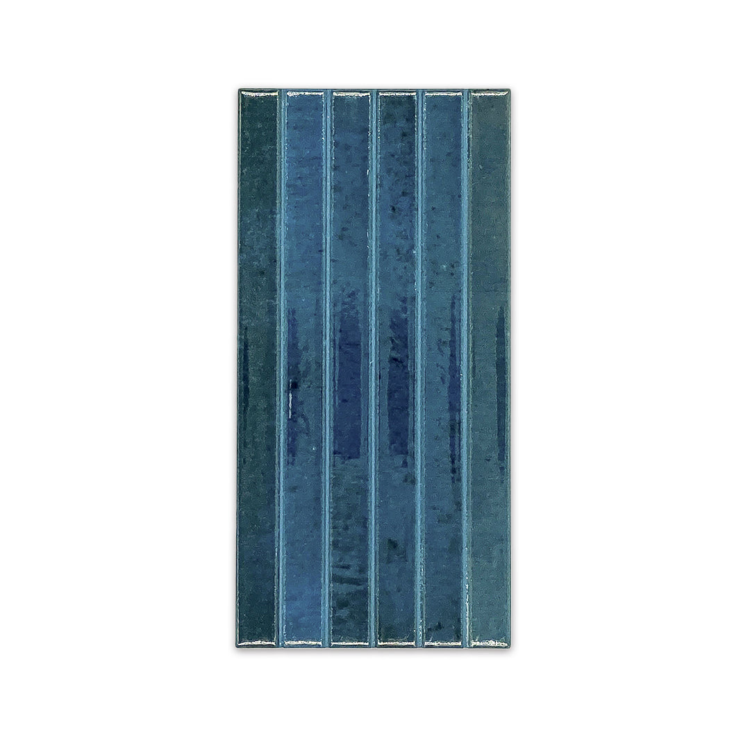 Ariel view of a single 5x10 panel tile in glossy navy blue, the tile has a 3D linear faux grout line kitkat look. 