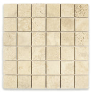 Ariel close up of a 2x2 square mosaic tile that resembles travertine stone in beige. 