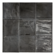 Ariel view of a group of nine glossy 4x4 black tiles. Highlighting the slight colour variations, texture and finish.