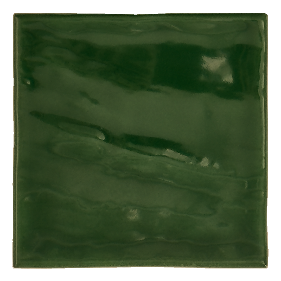 Ariel view of a single glossy 4x4 textured green tile showing the rich colour and textured edges. The glossy finish catches the light. 