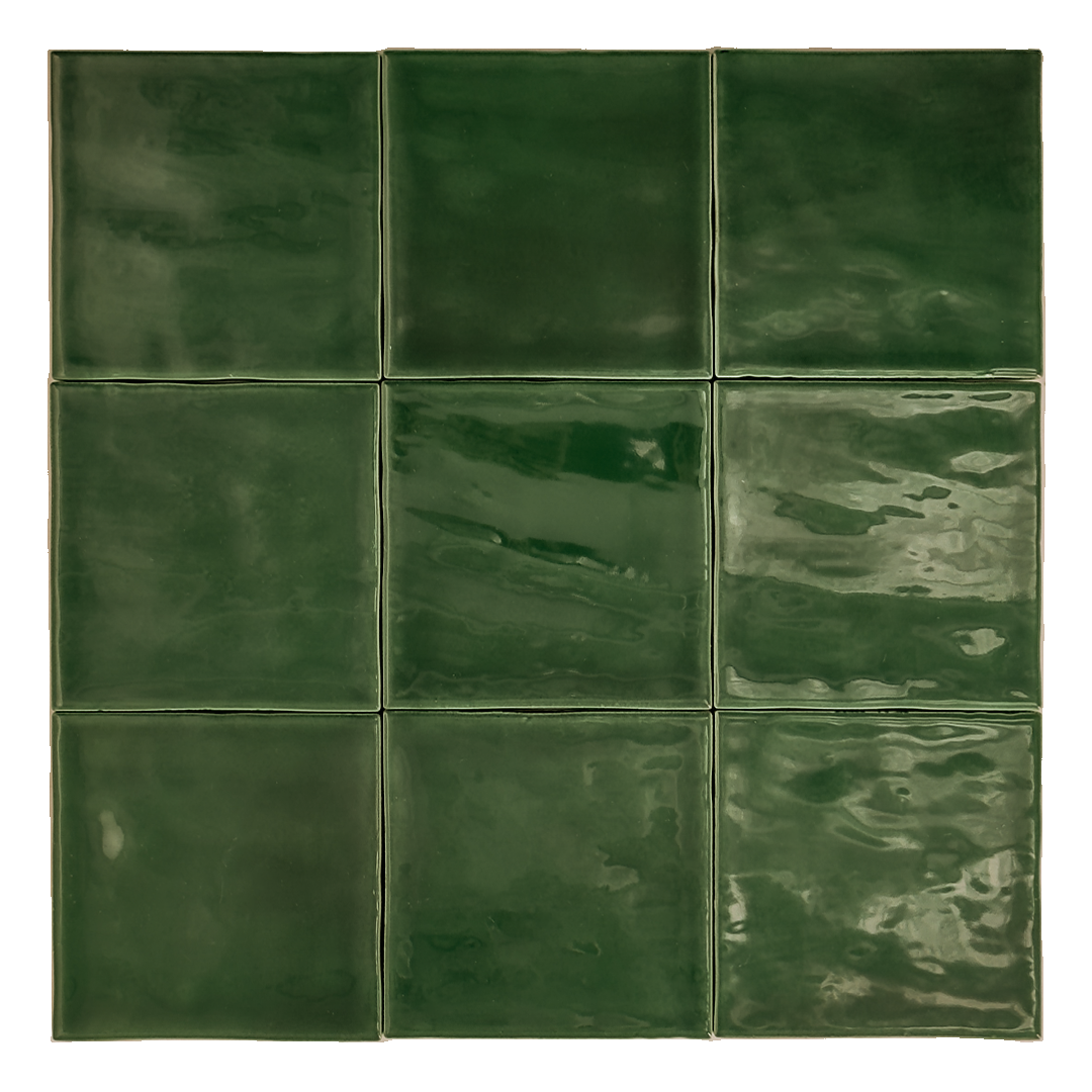 Ariel view of a group of glossy 4x4 textured green tiles showing the colour and texture. The glossy finish catches the light. 