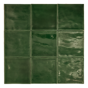 Ariel view of a group of glossy 4x4 textured green tiles showing the colour and texture. The glossy finish catches the light. 