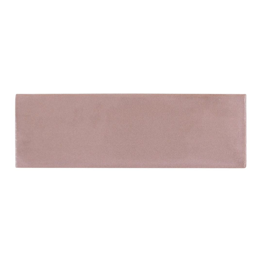 A single 2x6.5 glossy pink subway tile. 