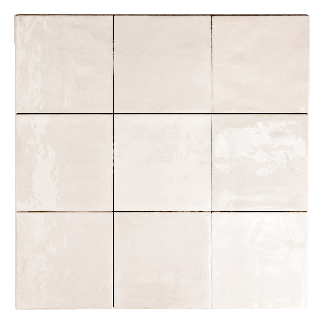 Ariel view of a group of glossy 5x5 textured light beige zellige tiles showing the textured edges and colour variation. 