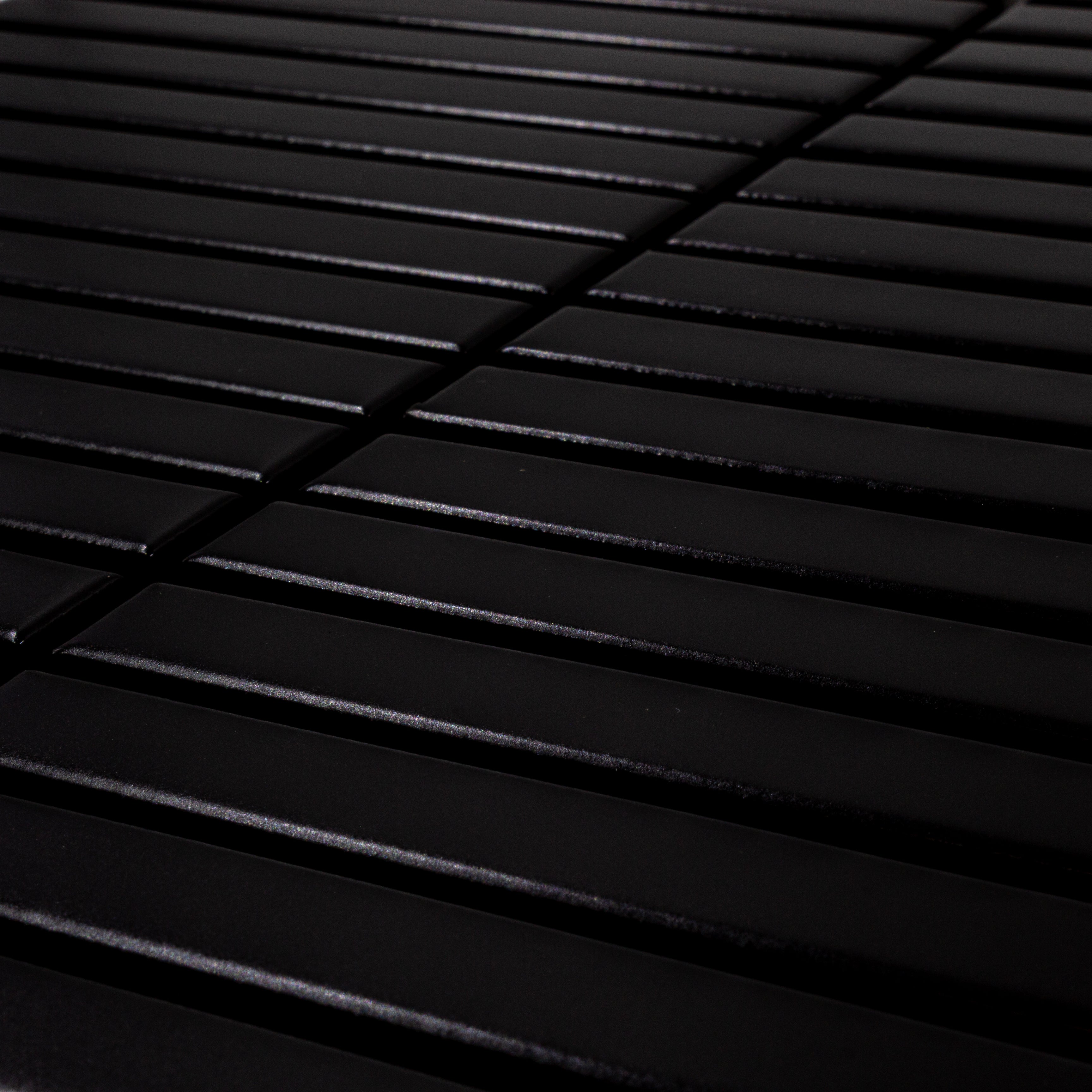 Angled close up view of a single sheet of kitkat stacked mosaic tiles in matte true black. The sizing is 5/8' x 5-5/8" per tile, 11" X 12" per sheet