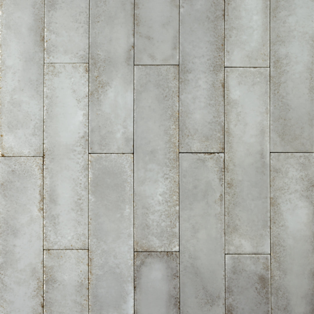 Ariel view of 2x9 grey glossy tiles in a brick layout with colour variation