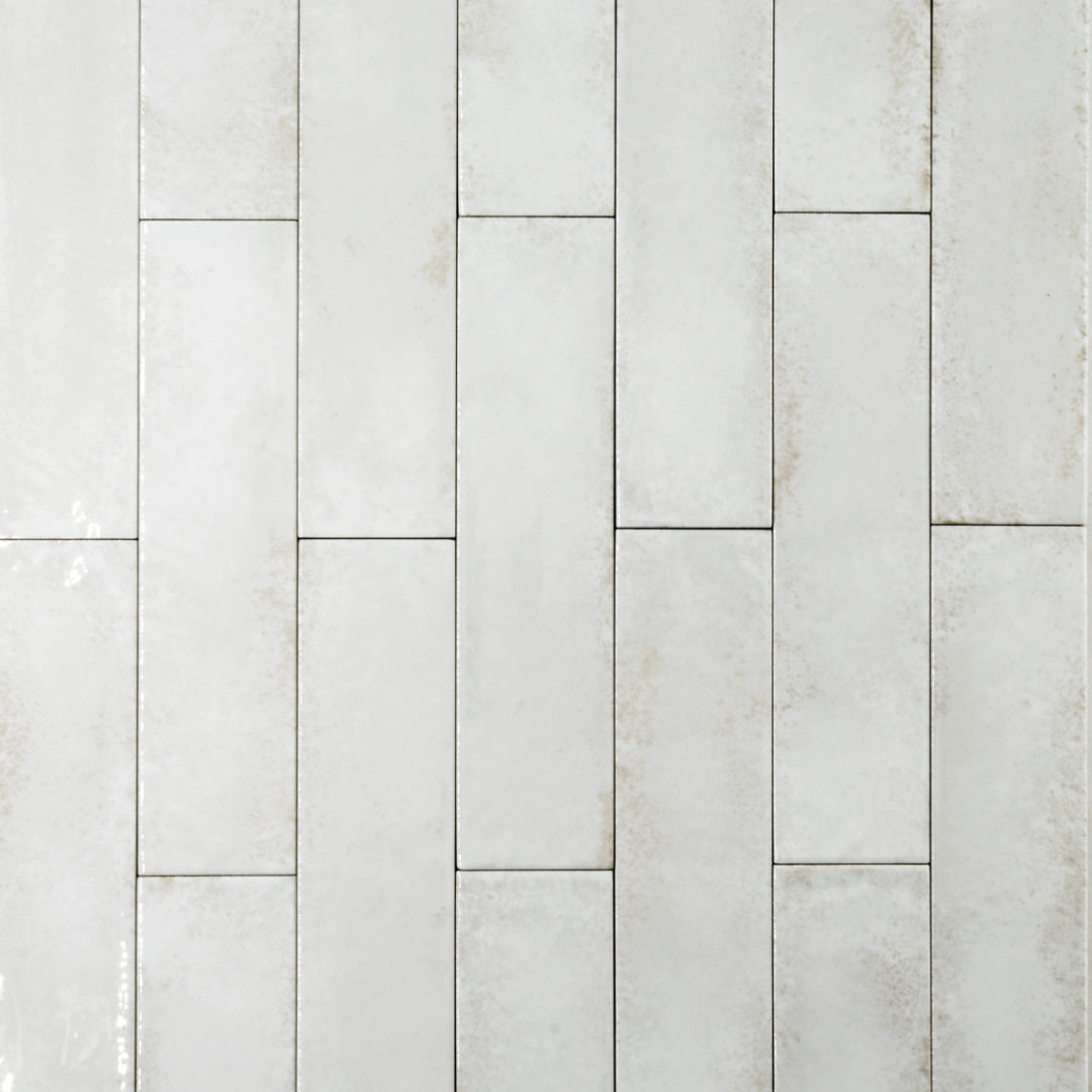 Ariel view of 2x9 white glossy tiles in a brick layout with colour variation