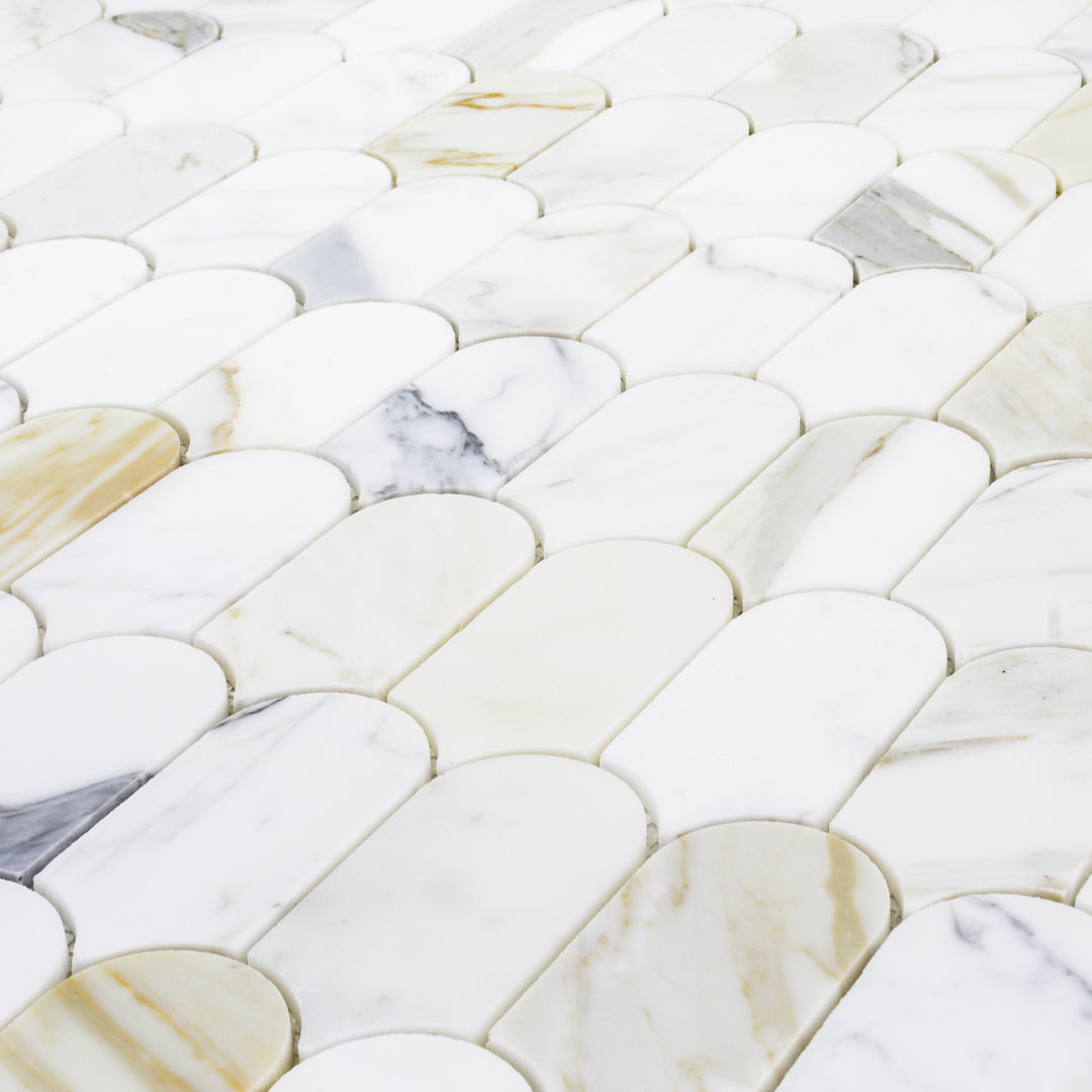 angled close up to show the colours in the natural marble stone calacatta feather matte mosaic
