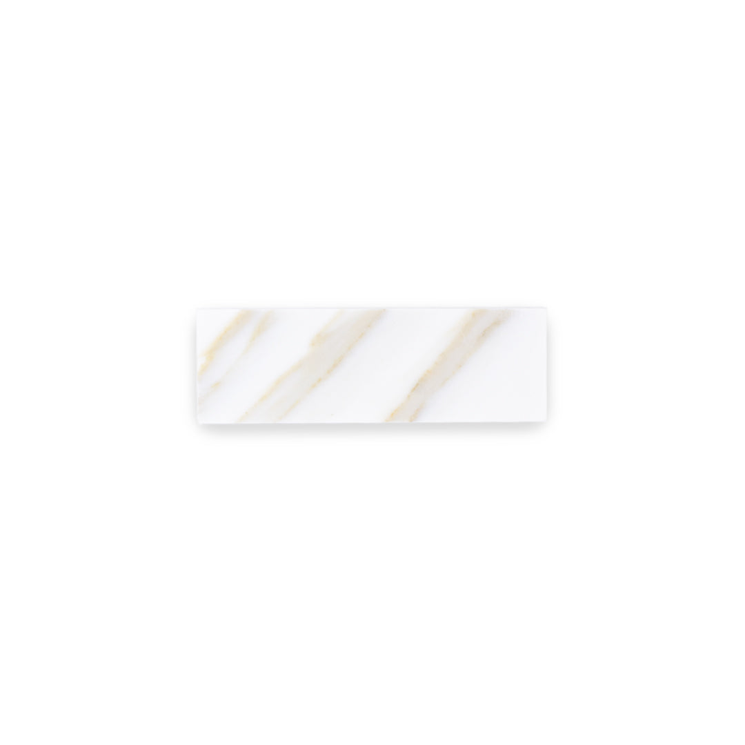 a single 2x6.5 natural marble stone calacatta gold matte subway tile