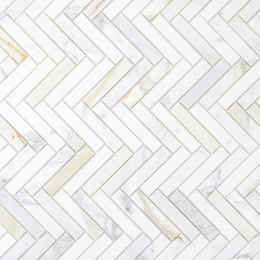 group of natural stone mosaic in herringbone calcatta gold 