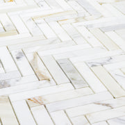 close up of calacatta natural stone herringbone mosaic. 