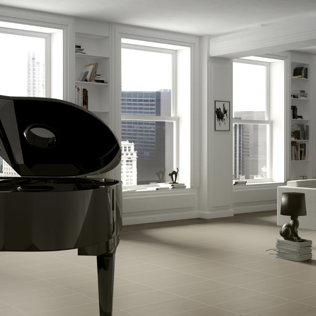 An upscale penthouse with a monochromatic look featuring white modern walls and the Checkmate beige 12x24 on the tiled floor. 