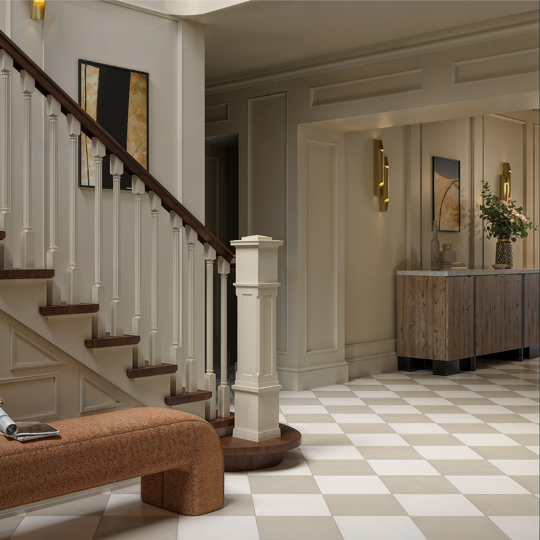 A traditional styled foyer with a classic wood elements including a staircase and wall mouldings. The timeless floors adored with beige and white 12x12 tiles in a diamond checkerboard pattern. 