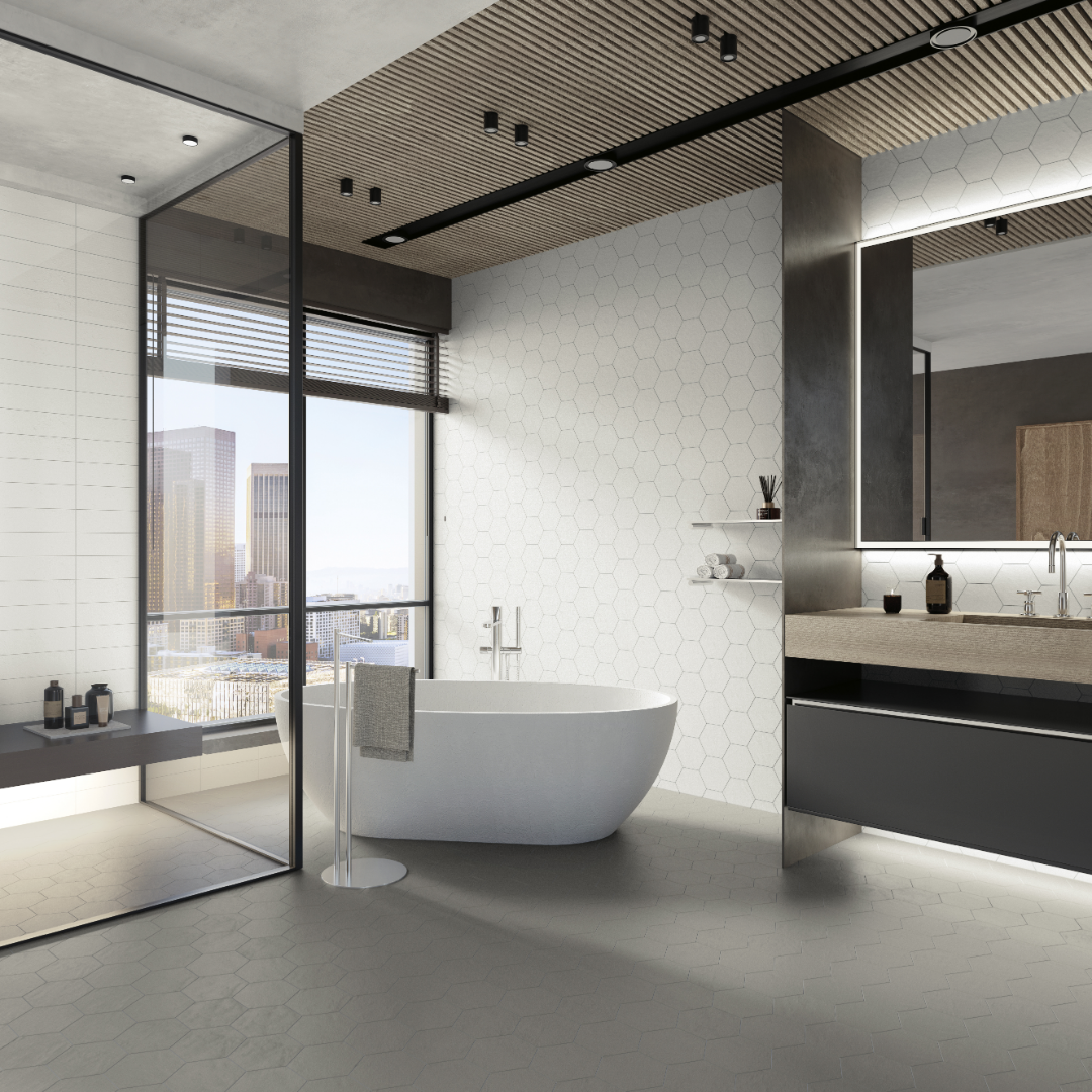 A neutral modern bathroom spa featuring Grey 9x10 Hexagon tiles on the bathroom floor, and White 9x10 hexagon tiles on the bathroom vanity wall and wall behind the bathtub. 