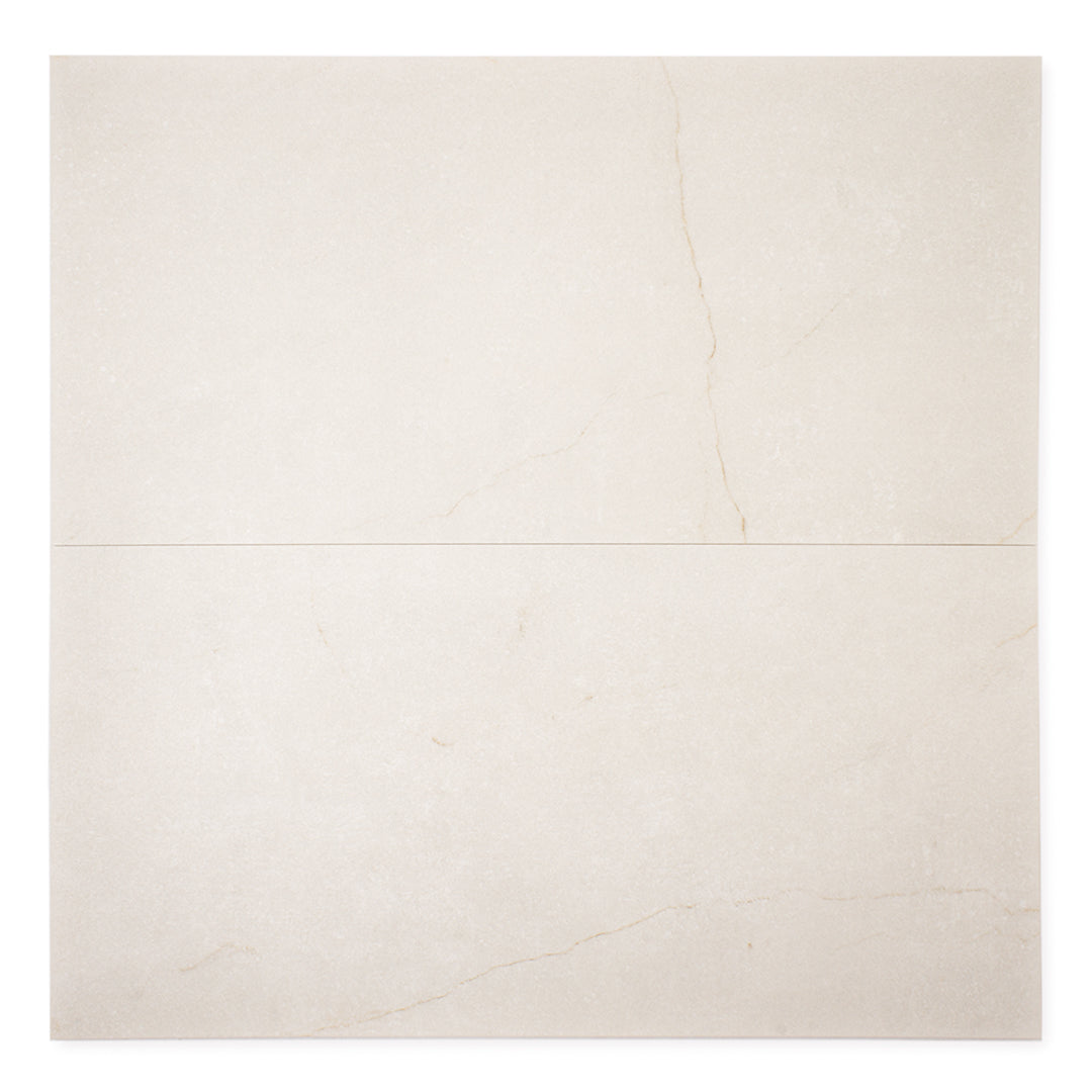 Ariel view a of two side by side 12x24 creamy white avorio marble look tiles with thin veining showing the delicate pattern.