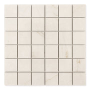 Ariel view of a 2x2 square sheet mosaic tile that is a cream avorio marble look with thin fine beige veining and matte finish