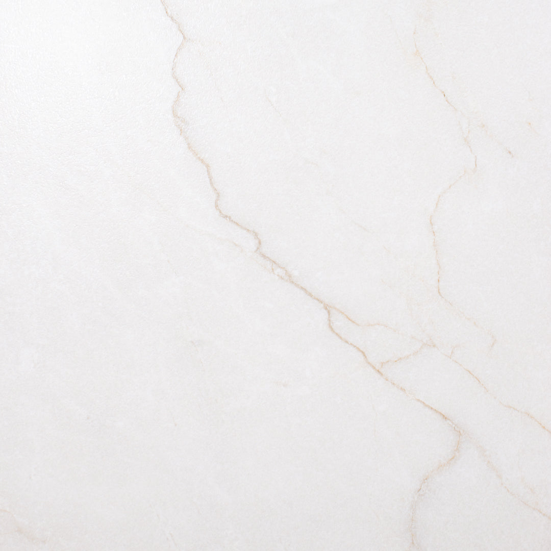 A close up view of a 24x48 marble look bianco white tile with thin grey veining 