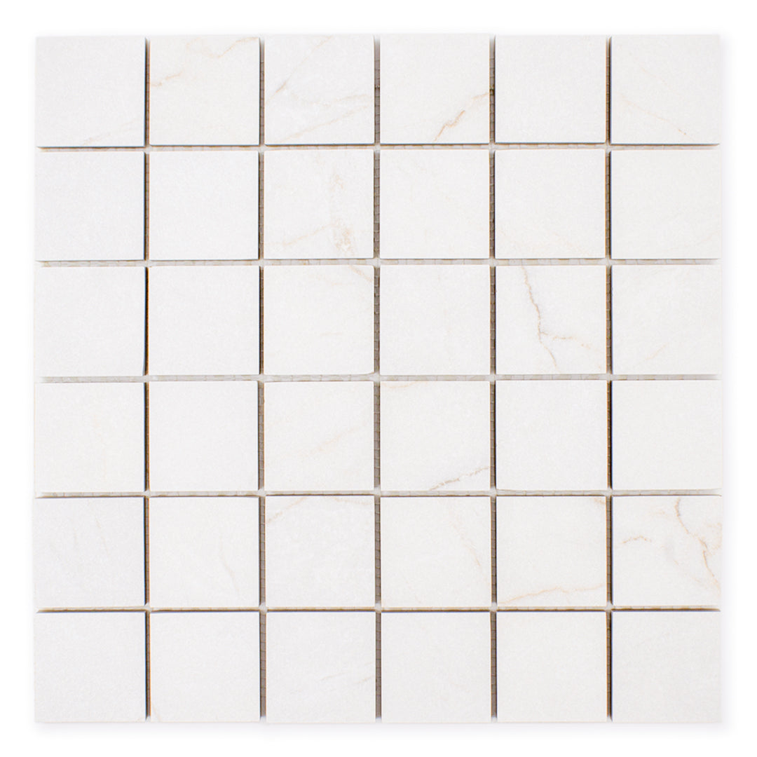 Ariel view of a 2x2 square sheet mosaic tile that is a white bianco matte marble look with thin grey veining. 