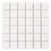 Ariel view of a 2x2 square sheet mosaic tile that is a white bianco matte marble look with thin grey veining. 