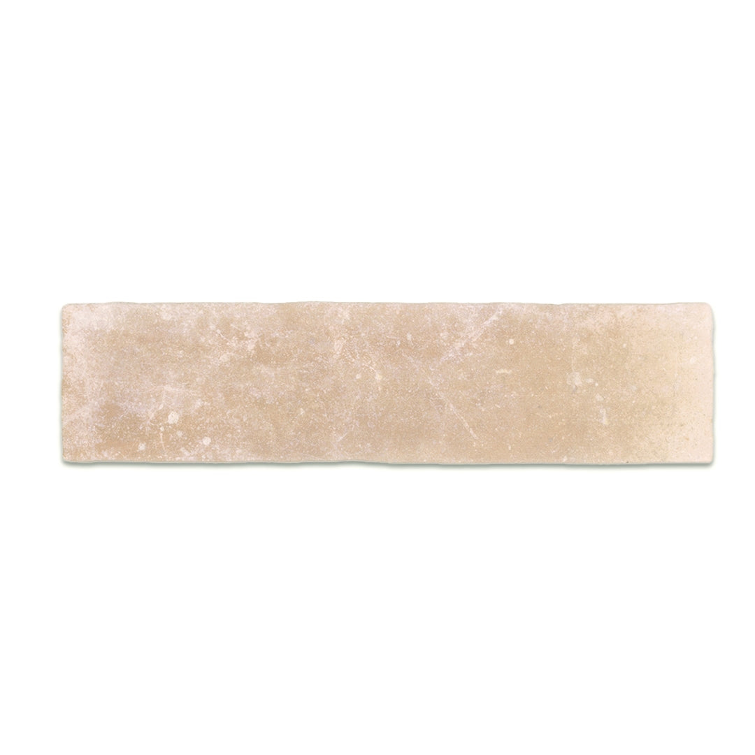 A single 11x2.75 brick clay sand beige stone look tile with a natural looking edge and pattern