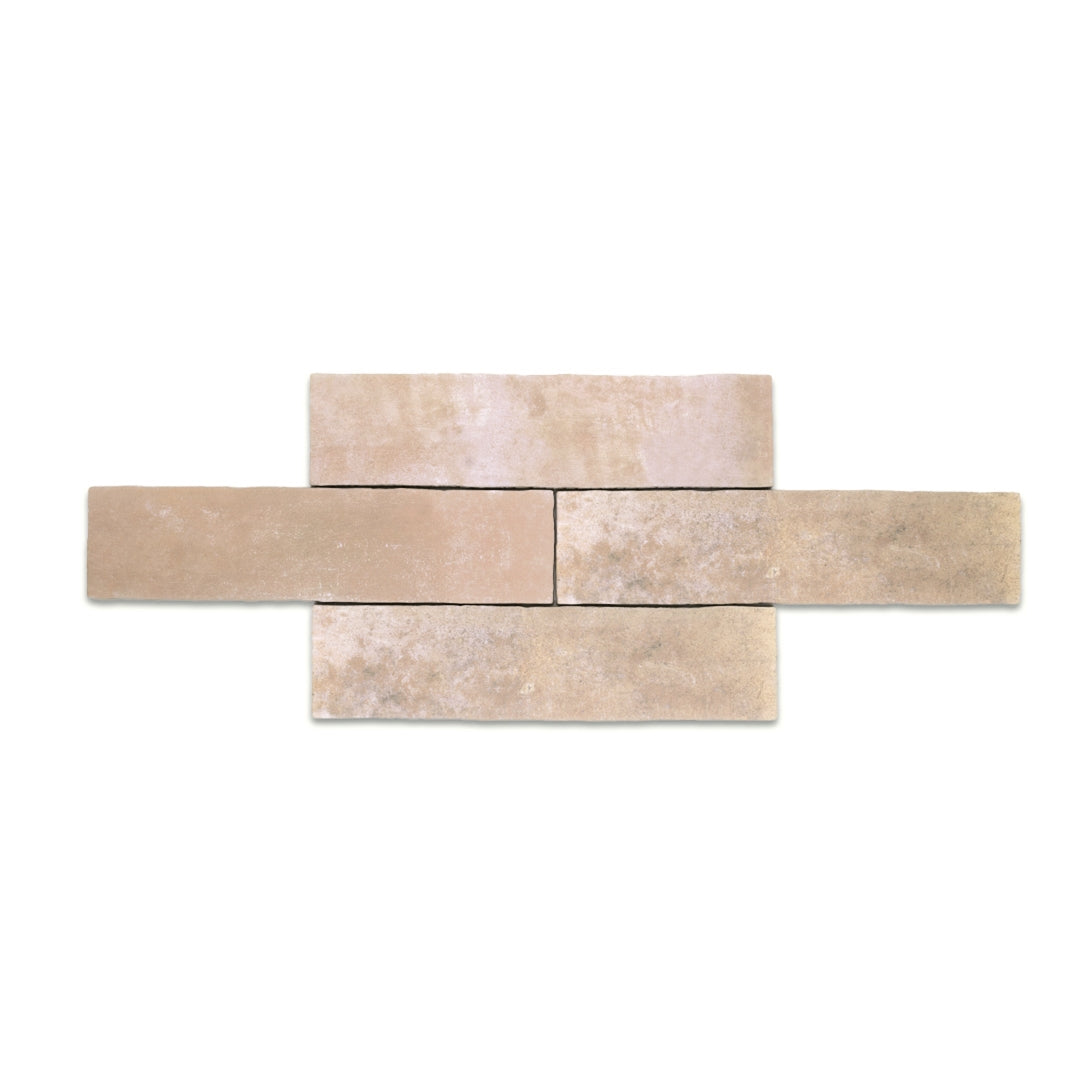 A group of 11x2.75 brick clay sand beige stone look tiles with a natural looking edge