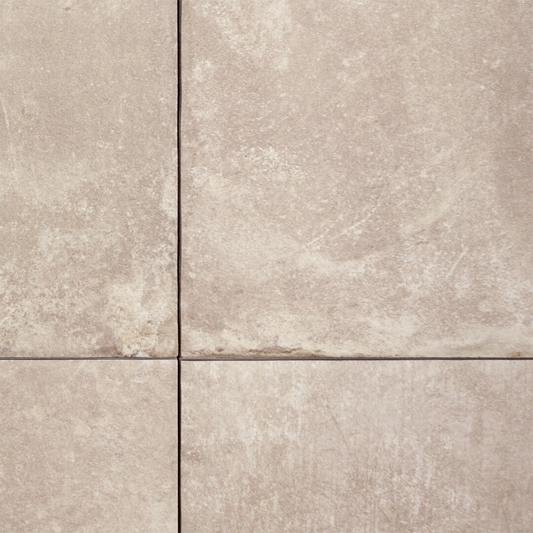 Ariel close up of a multiformat porcelain paver look tile in cream beige colour to highlight the tumbled texture and pattern. 