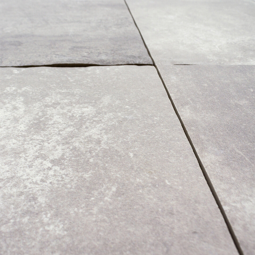 Angled close up of our cottage stone gray porcelain paver look multiformat tiles.