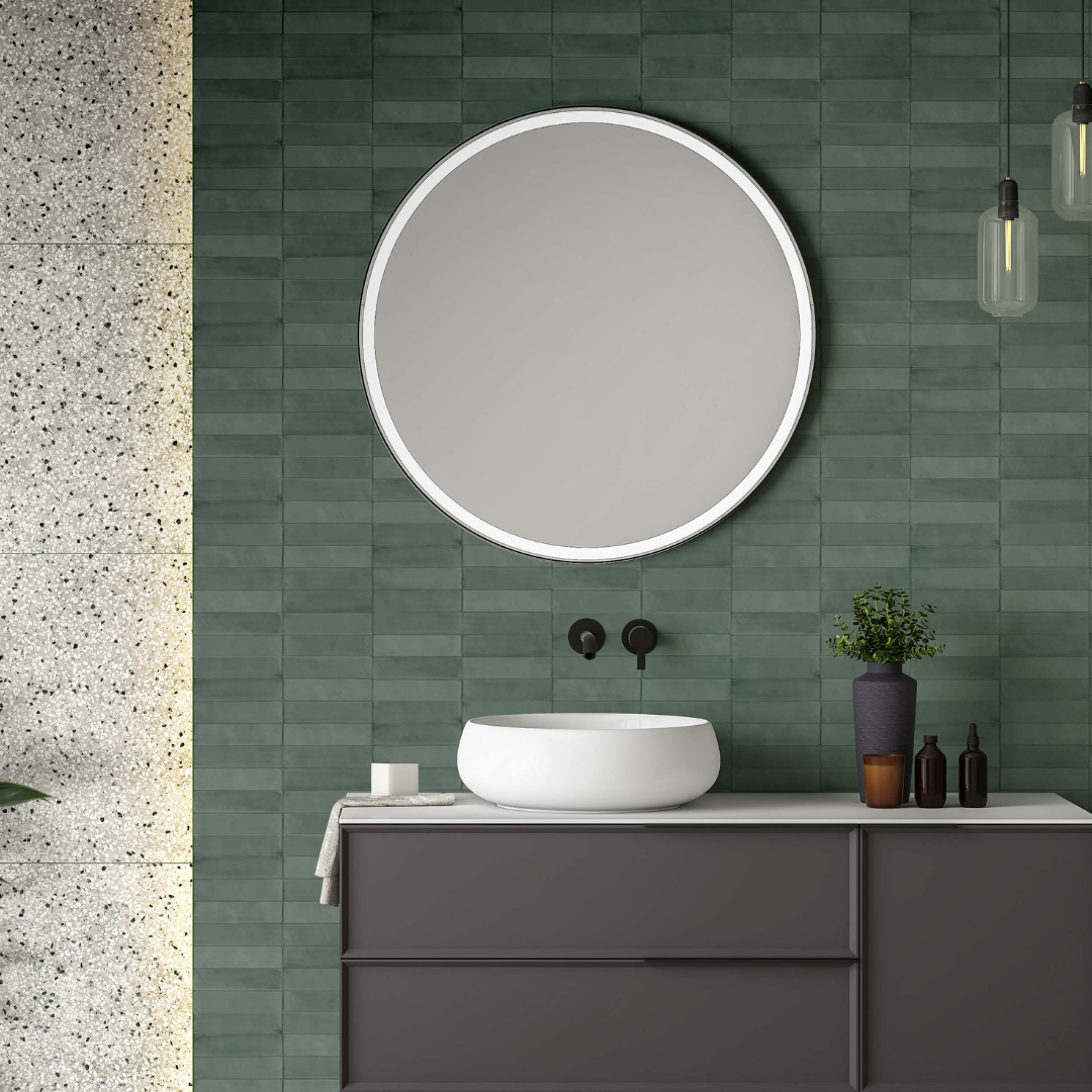 Horizontal stack installation on a bathroom vanity backsplash featuring a 2x9 forest green matte subway tile with texture and subtle colour variation. 