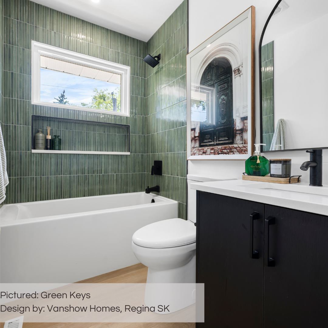 A luxurious black and white bathroom with rich green fluted tiles on the shower walls and niche. the tiles are tilesinpired green keys tiles. 