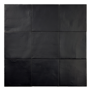 Ariel view of a group of matte 5x5 textured carbon black tiles showing the textured edges. 
