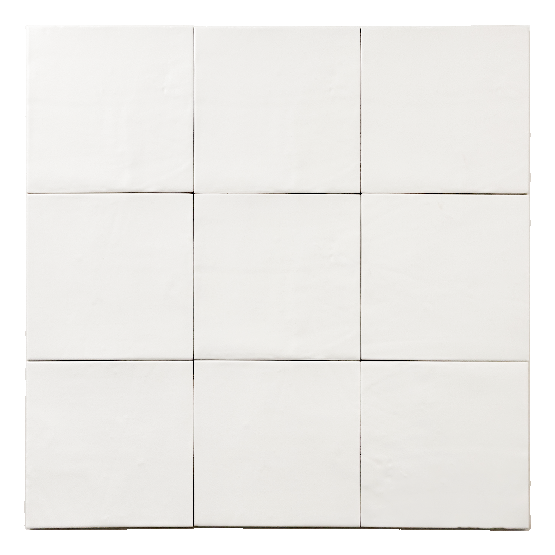 Ariel view of a group of matte 5x5 textured powder white tiles showing the textured edges. 