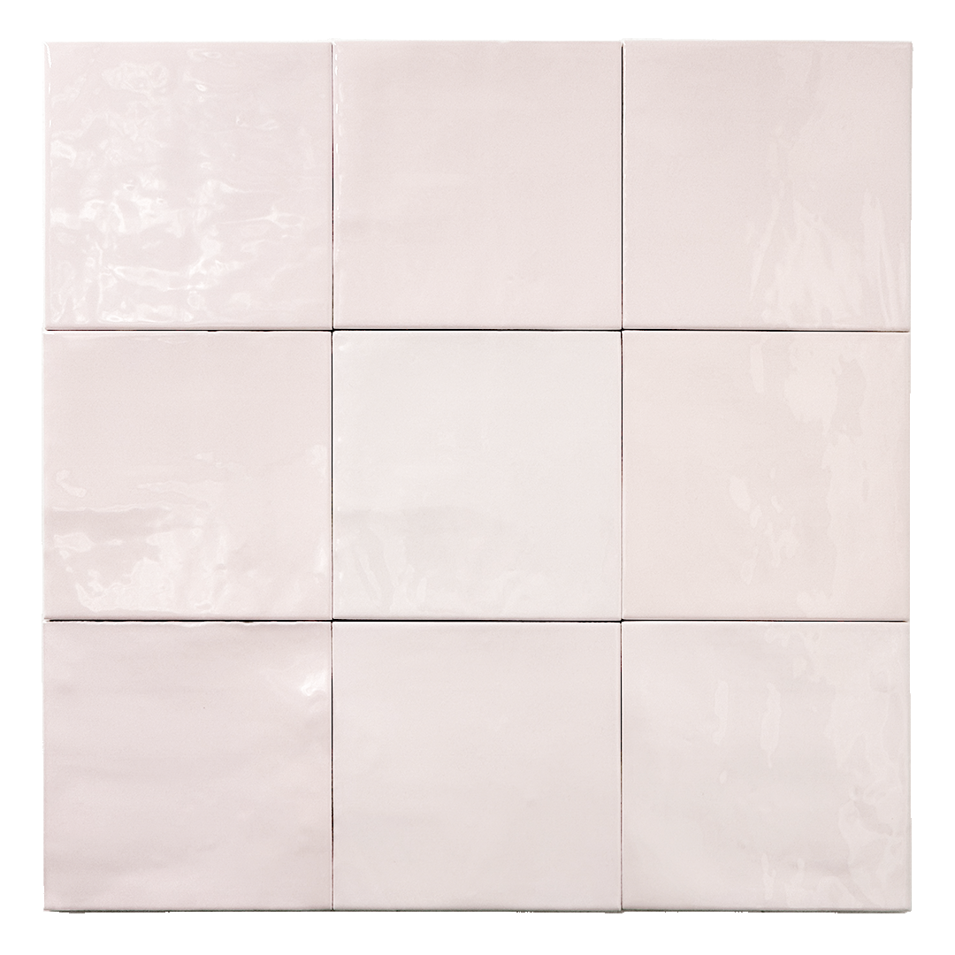 Ariel view of a group of matte 5x5 textured light blush pink tiles showing the textured edges. 