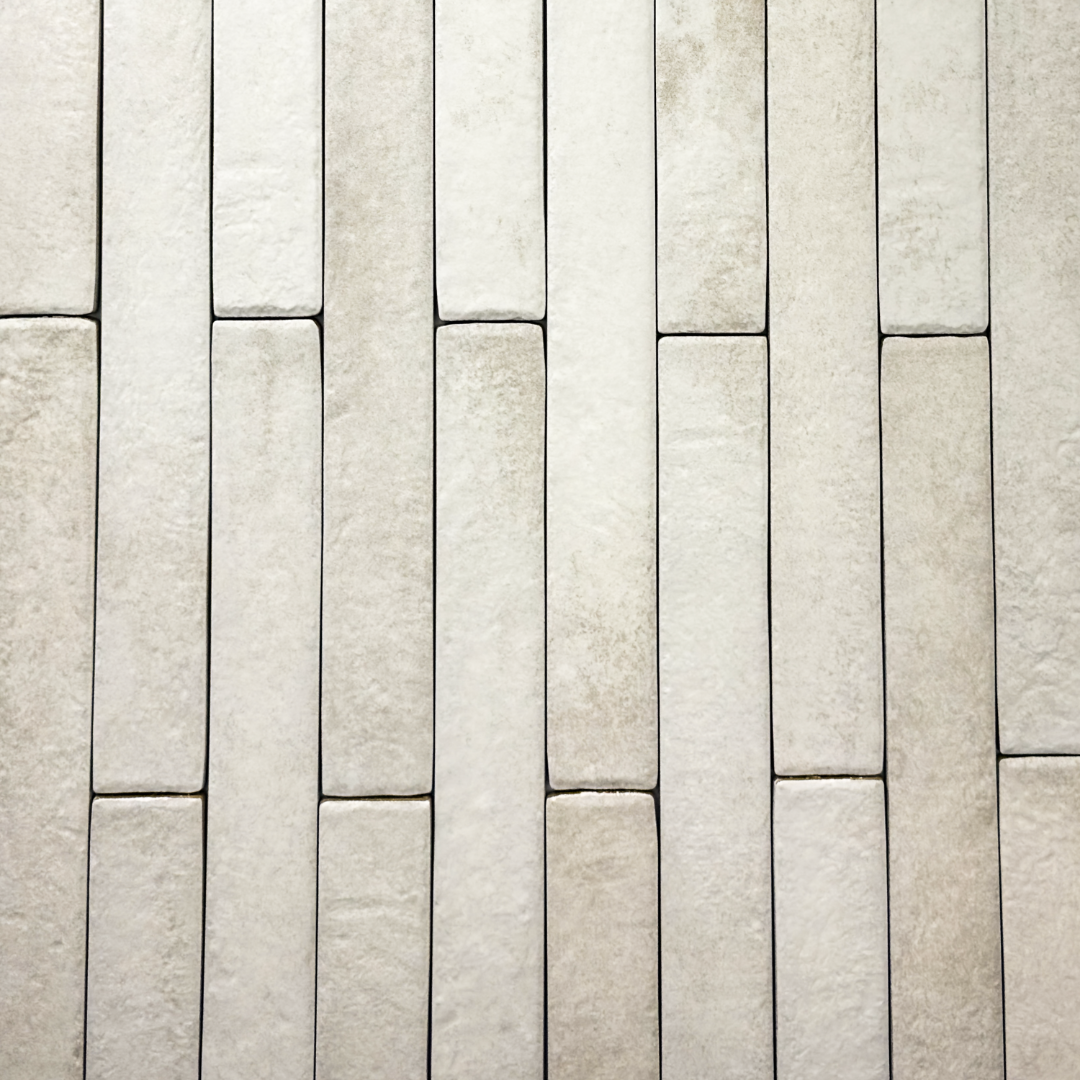 Ariel view of off white 2x18 brick look tiles in a vertical brick pattern. Showing the texture, colour variance and finish of the tiles.