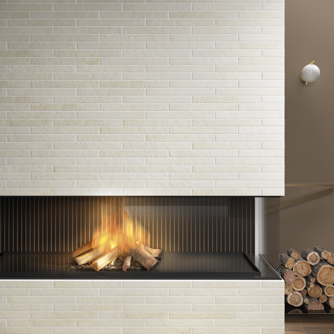 A modern living room with warm accents and a fireplace. The face of fireplace is offwhite 2x18 brick look tiles in a horizontal brick pattern with some colour variation and texture. 