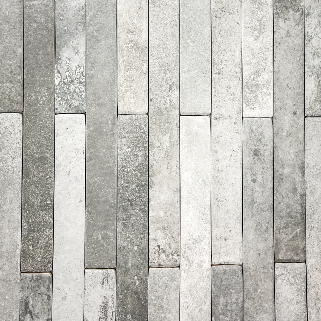 Ariel view of grey 2x18 brick look tiles in a vertical brick pattern. Showing the texture and finish of the tiles.