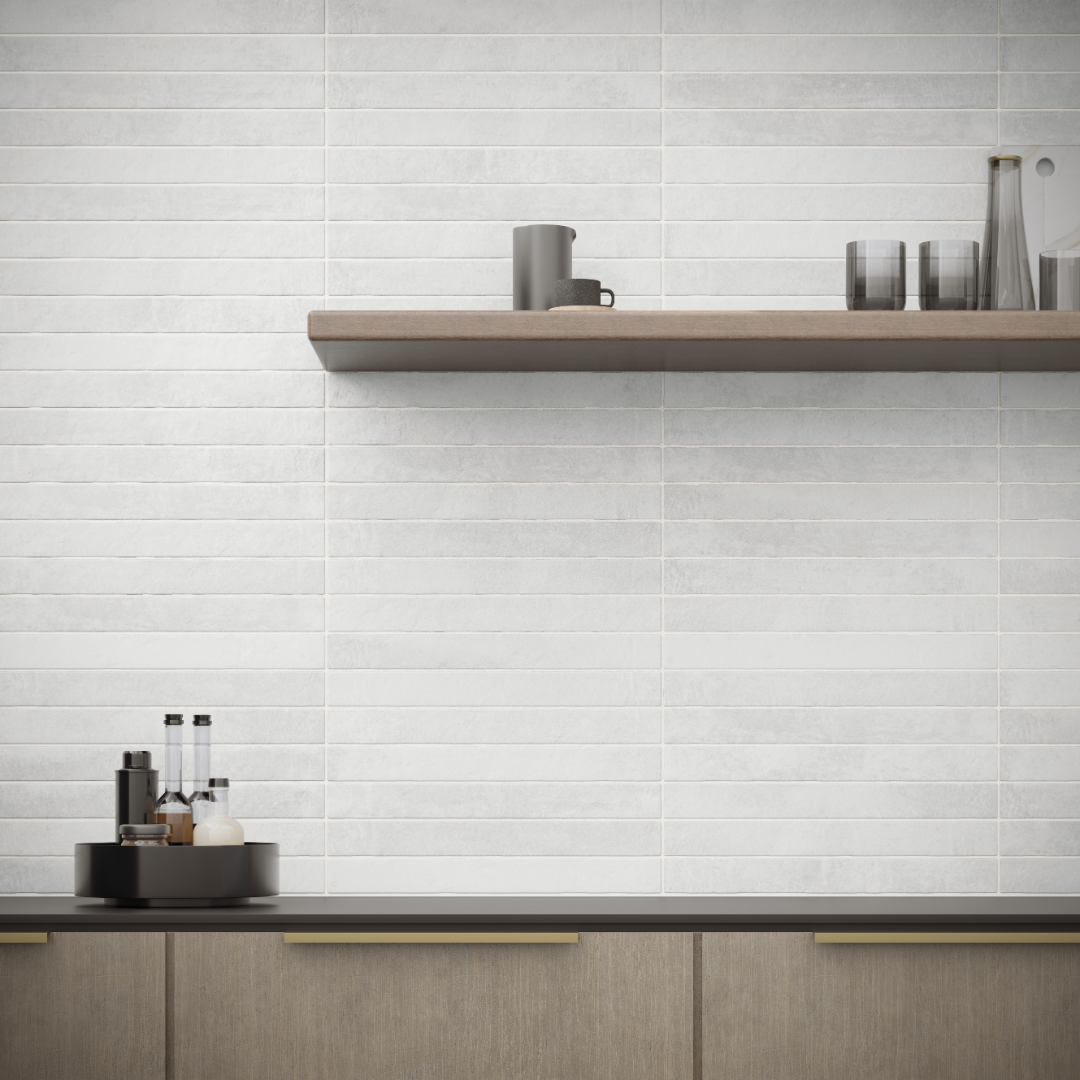 A minimalist modern kitchen backsplash with open shelving and wood accents. The backsplash tiles are white 2x18 and have the appearance of brick stone. They are installed in a horizontal stack pattern. 