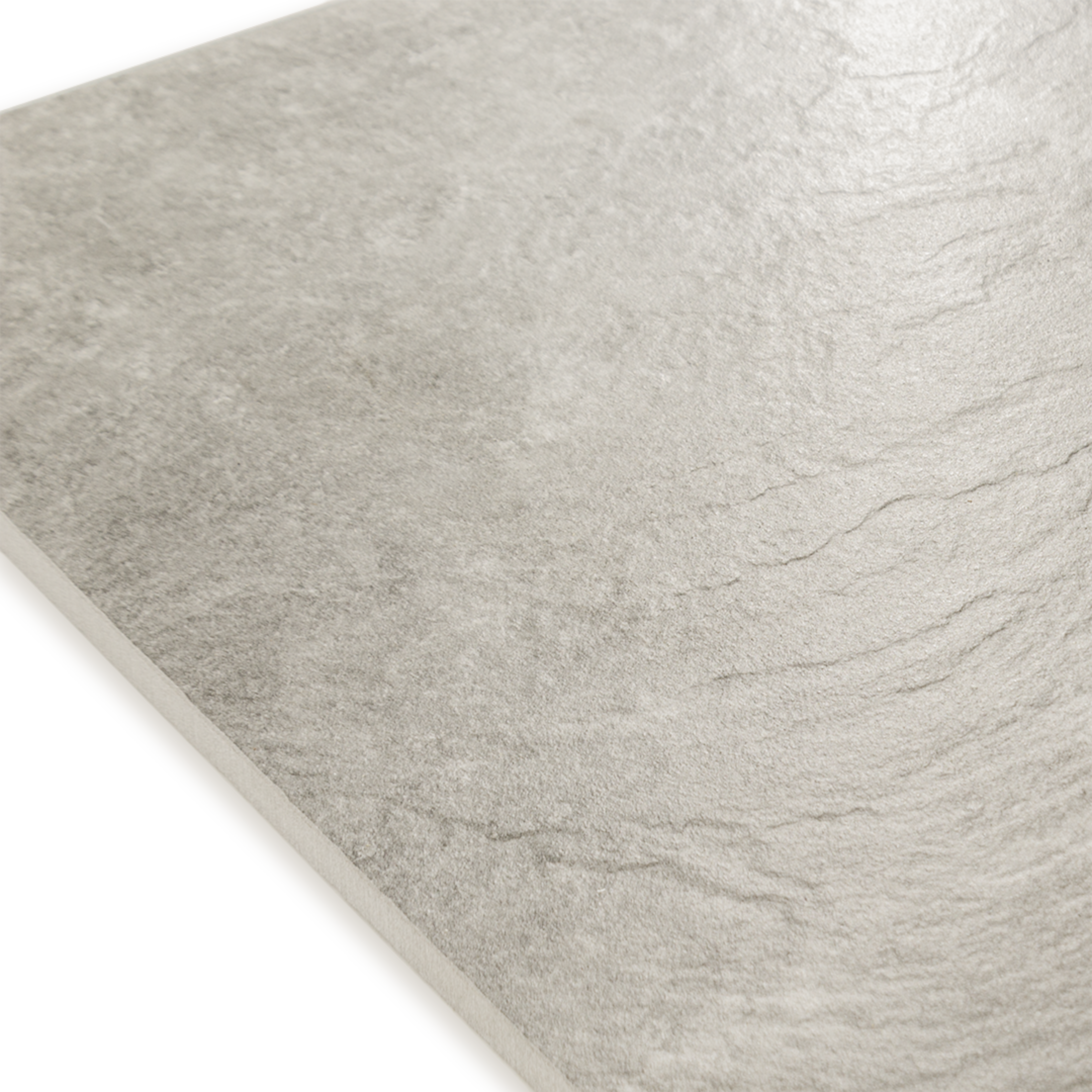 Angled close up of a stone look beige tile showing the texture and finish.