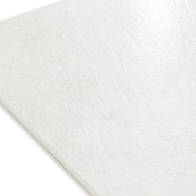 Angled close up of a stone look white tile