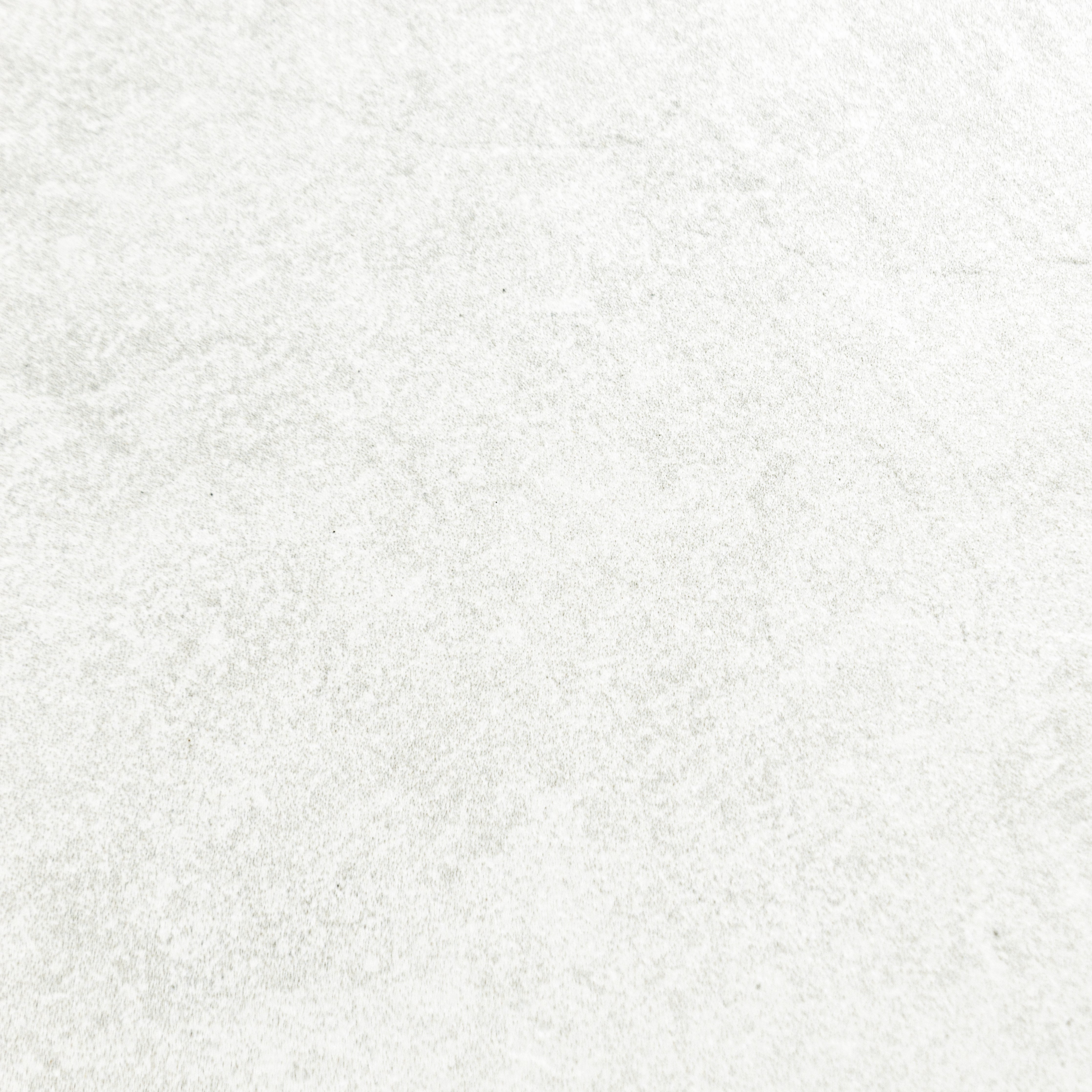 A close up of white stone look tiles with veining and a colour variated pattern.