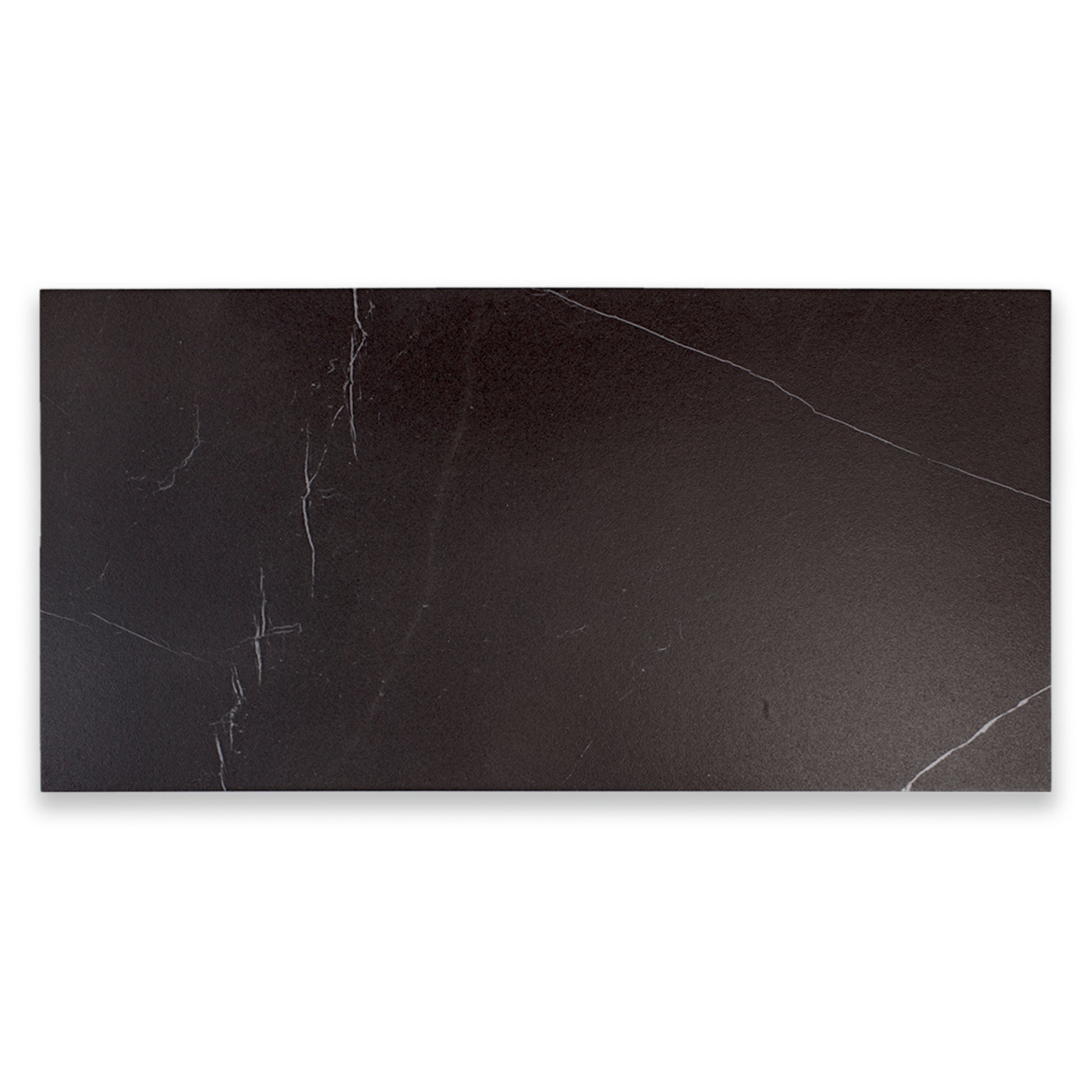 Ariel view of a single 24x48 tile in matte black marble look porcelain with white veining. 